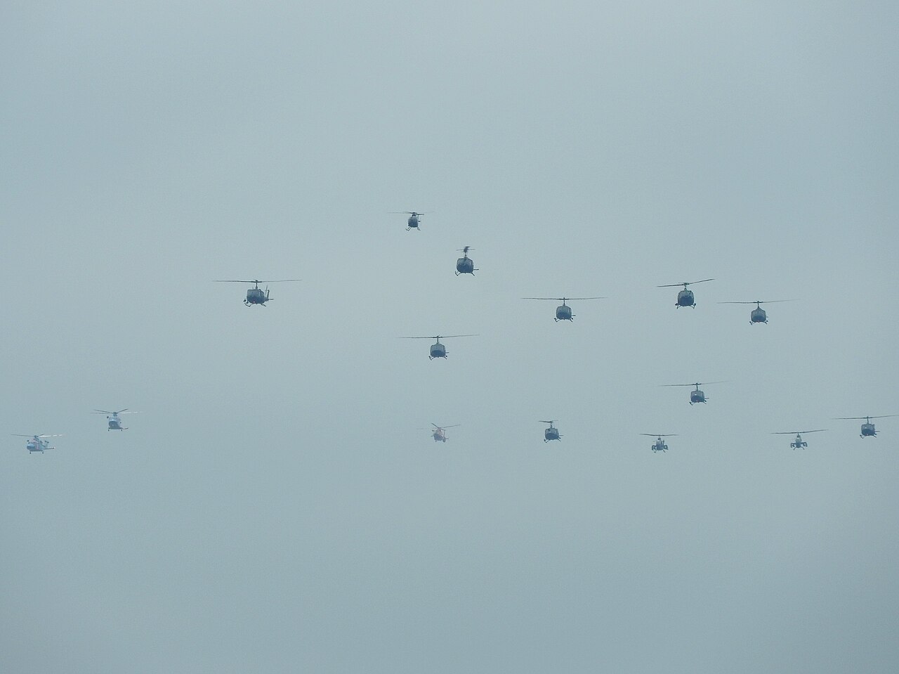Self-Defense Force, police and fire department helicopters flying in formation at the 2016 Tachikawa air show