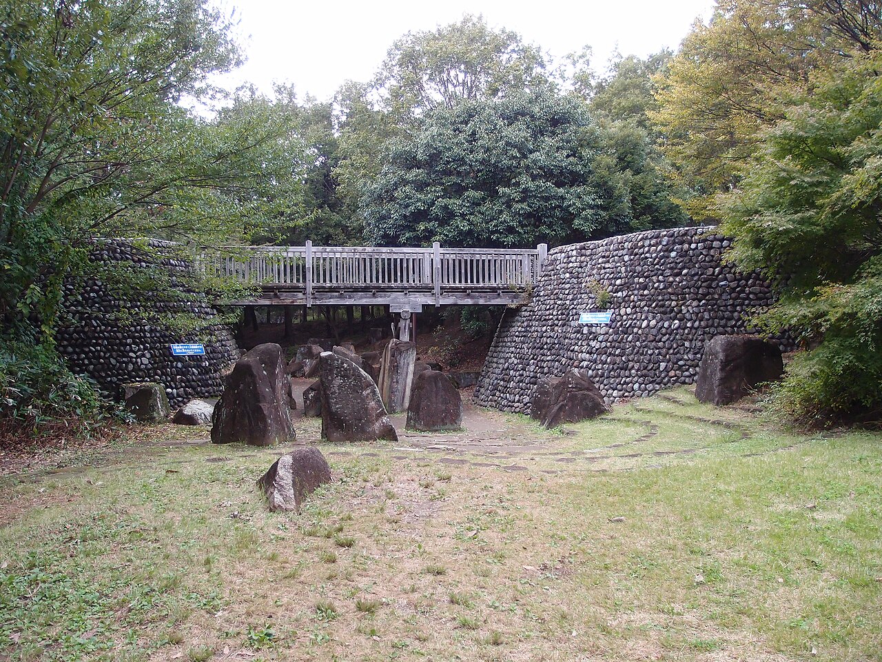 Stone Valley in the Children's Forest at Showa Kinen Park: big rocks with a wooden bridge beyond.