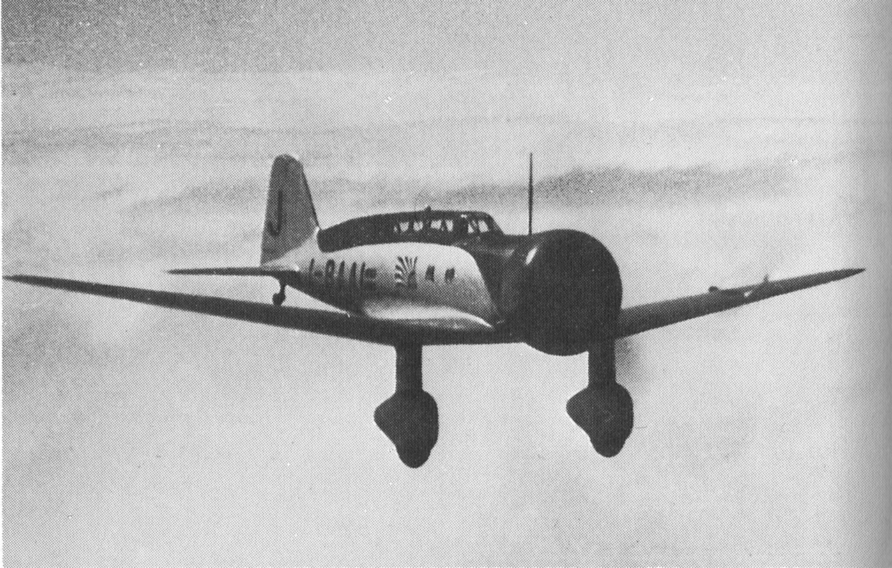 The Kamikaze-go above the clouds, seen from the front, with streamlined covers on its main wheels.