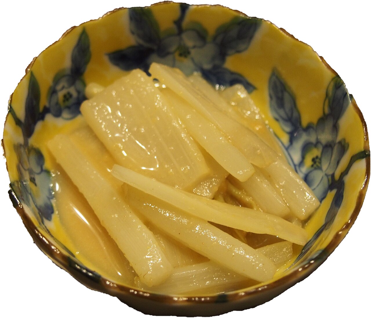 Udo nuta: strips of white udo dressed with vinegared miso in a small indigo-patterned bowl.